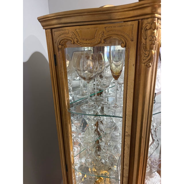 This curio has been in my family for 52 years. Over the years it has been the home to blown glass pieces and currently it...