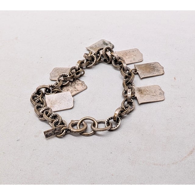 Vintage 1930s Signed Monet Silvertone Coat of Arms Charm Bracelet For Sale In Philadelphia - Image 6 of 8