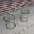 This is a pair of Leon Rosen for Pace brass and glass corkscrew side tables.
