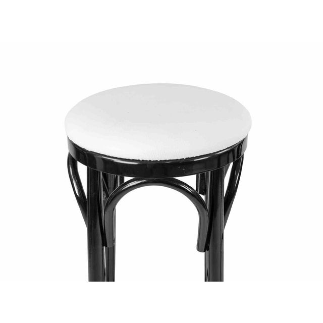 Vintgae pair of stools realized in Italy in 1970s in the style of Art Déco. Lacquered wood and white leather seat. Very...