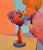 Woman with a colorful flower vase. Presented in a rustic wooden frame. Unsigned. Image: 28"H x 22"W. Unknown Bay Area...