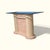 Postmodern console table from the 1980s with a rectangular glass top, tessellated stone base, and rounded textured column...