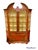 A wonderfully scaled mid-sized display cabinet in red lacquer with Chinoiserie decorations made by the New York City firm...