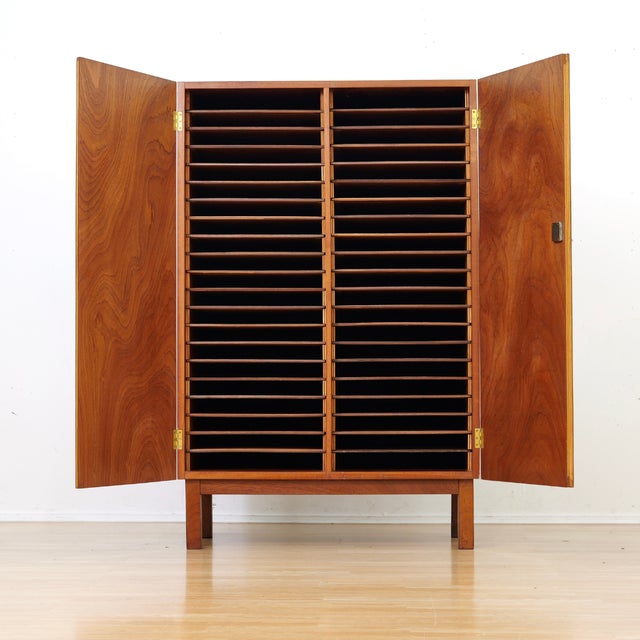 This fantastic vintage cabinet was produced in England during the 1950s. A heavy duty storage piece, the cabinet is made...