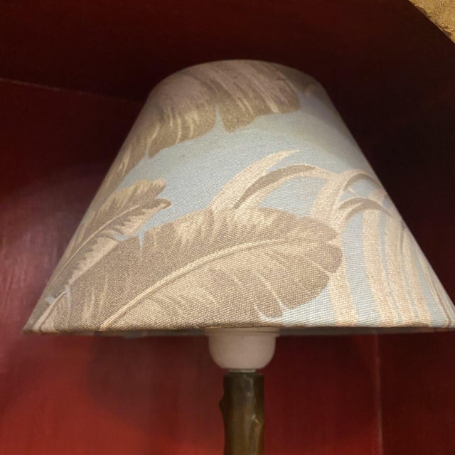 Art Nouveau style table lamp. The lamp base is made of burnished bronze, with a distinctly modernist decoration in the...