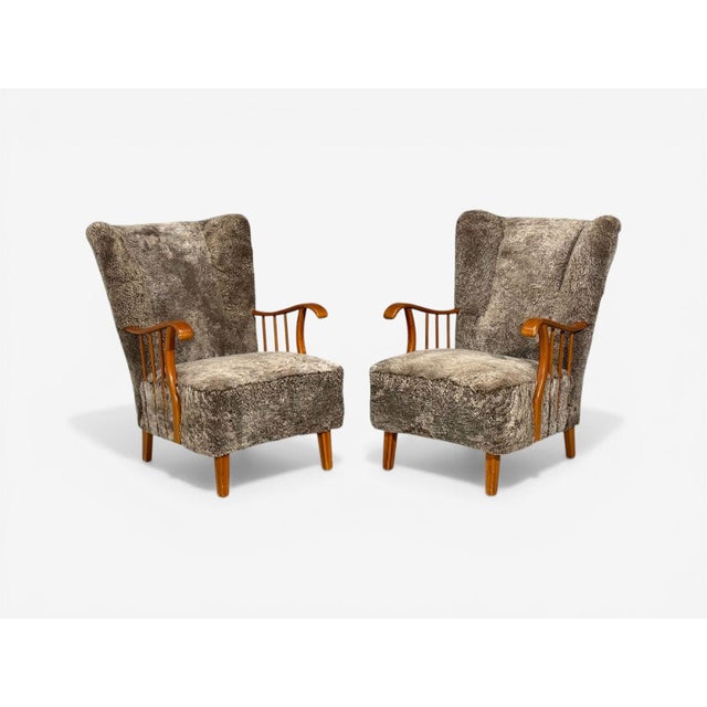 Swedish Mid-Century Modern, Lounge or Wingback Chairs, Elm, Gray Sheepskin, Sweden, 1940s Pair of charming Scandinavian...