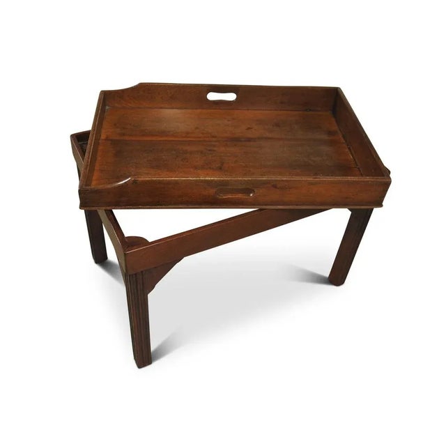 A Victorian Mahogany Butler's Tray with A Later Fixed Coffee Table Stand Terminating on Block Supports. Removable tray.