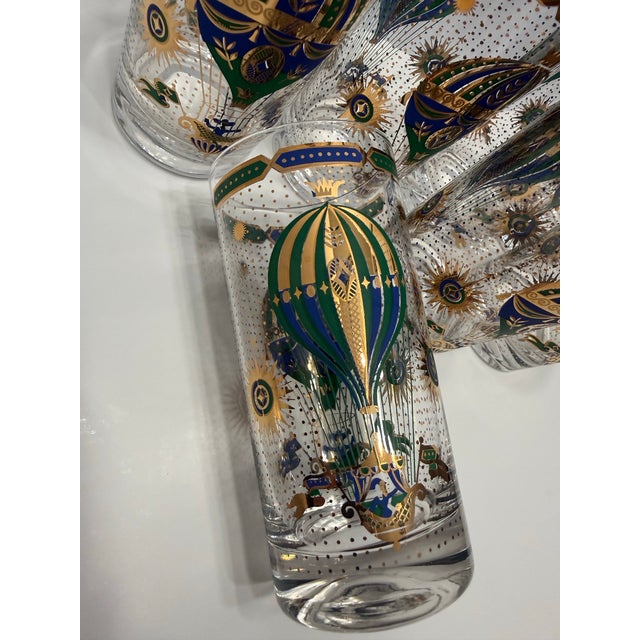 Authentic vintage mid-century modern barware set designed by Georges Briard, featuring a mercury fade pitcher and seven...