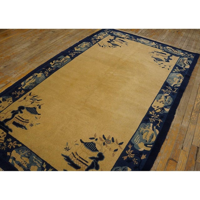 Antique Peking Small Scatter Size Wool Ivory Rug, Circa Date: 1900s. This exemplary piece of Chinese weaving represents...