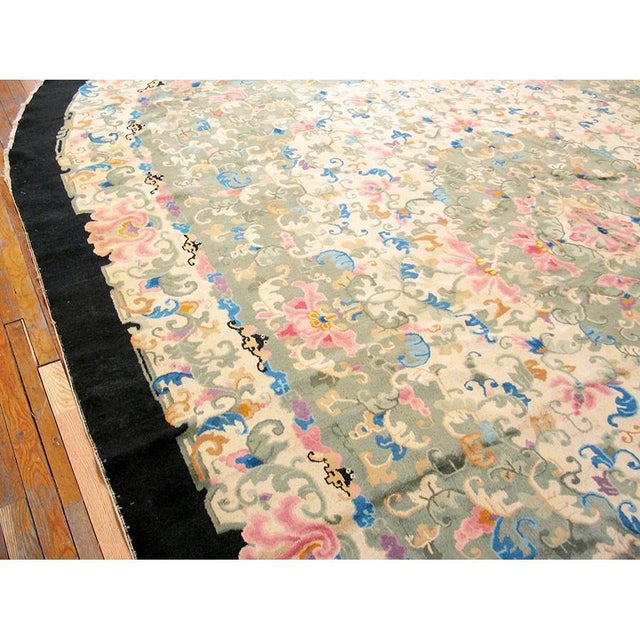 antique Large Oval Peking Chinese Knotted Green Color Area Rug, Circa Date: 1930s. This exquisite example of early 20th-...