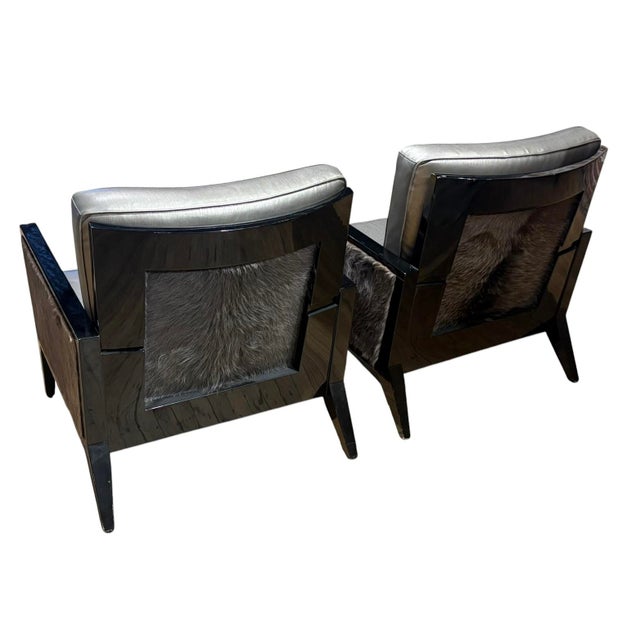 Pair of modern black lacquer chairs with silver metallic leather cushions and fur accents. Nice curved backrest detail....