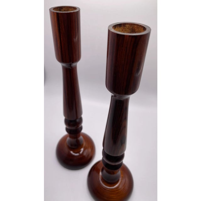 This is a beautiful pair of rosewood wooden candleholders! They have a gorgeous deep wood color and a smooth glossy...