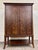This is a gorgeous contemporary entertainment armoire / media cabinet in a warm dark cherry finish with striking burl-look...