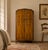 An elegant 1930s Art Deco wardrobe in beautifully figured walnut, with carved floral detailing, original handles and...
