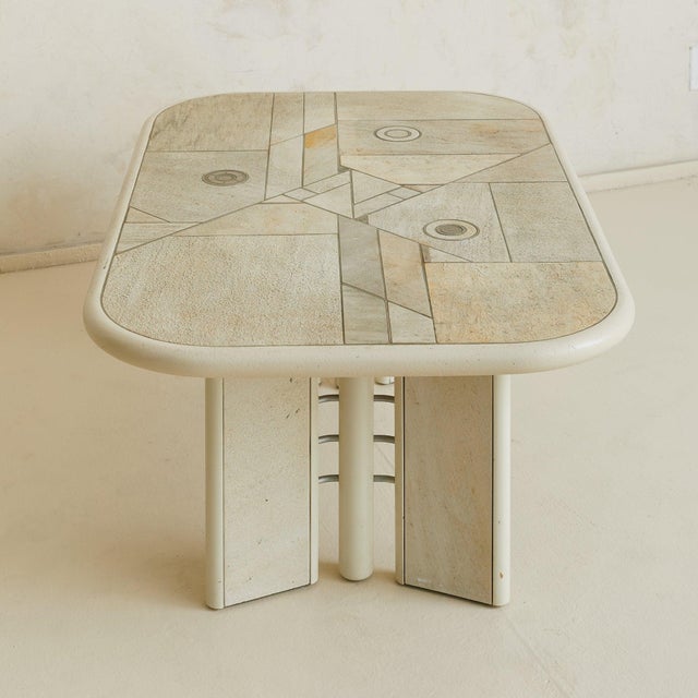 A Brutalist stone and metal inlay coffee table from the Netherlands, crafted in the 1970s in the manner of Paul Kingma....