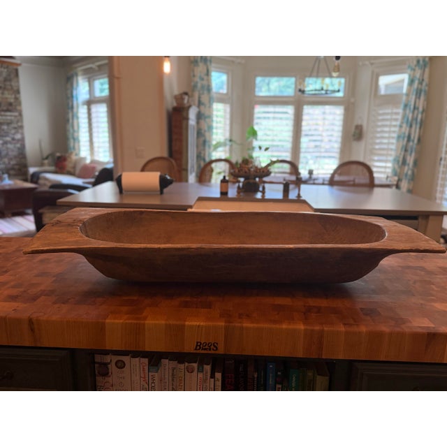 This exceptional antique hand-carved dough bowl is a beautifully preserved example of early farmhouse craftsmanship....