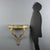 Small teardrop console table in fir, featuring a refined faux marble finish and gilded details. The molded top includes a...