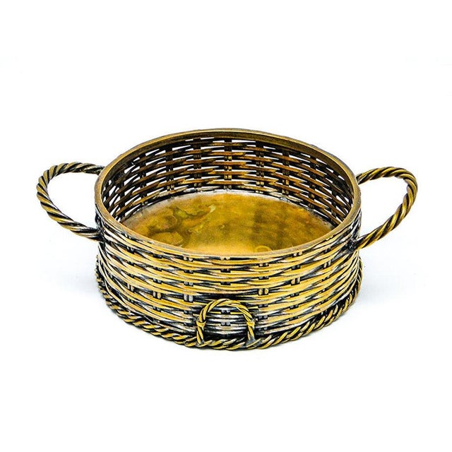 The bottle stand in the shape of a basket dates back to the early twentieth century. It was made in Cologne in Kölner...
