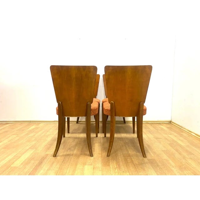 A set of four dining chairs designed by Jindřich Halabala and produced in Czechoslovakia during the 1960s. Commonly...