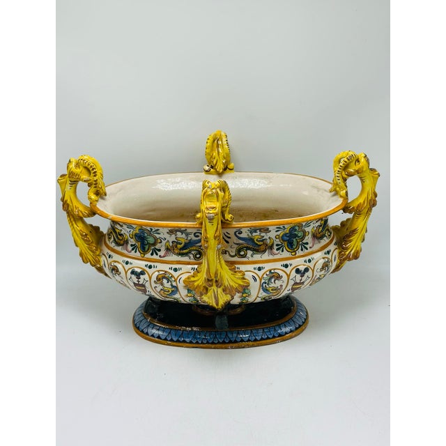This is a large, highly decorative antique ceramic centerpiece bowl, likely European (possibly Italian maiolica),...