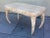 A faux marble desk with a single drawer and horned legs. Playing off Hellenic design, this heavy solid wood desk will add...