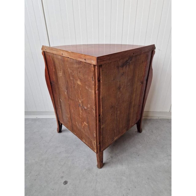 Corner cabinet with inlays. Mahogany veneer, marquetry, bronze fittings. France. 1920s. Height 77cm; 56x56cm