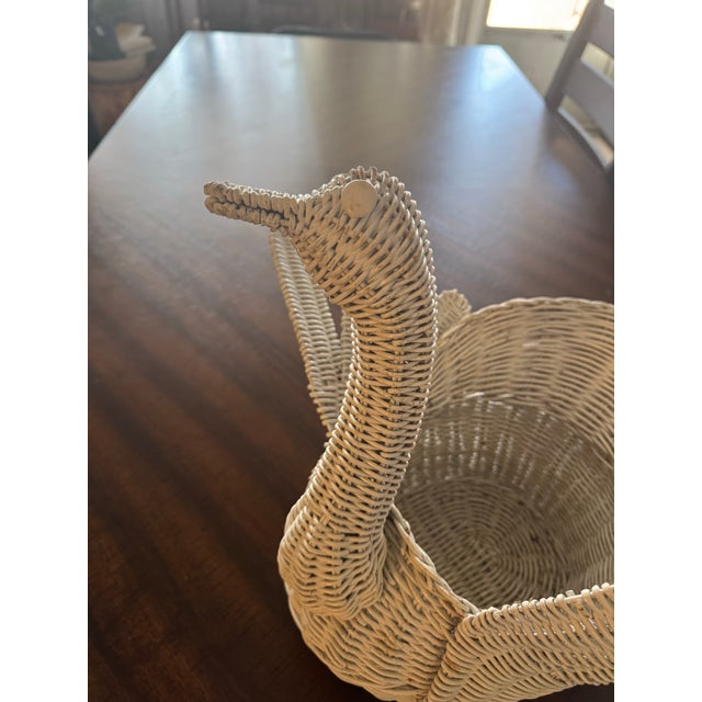 We have here a wonderful Mid Century wicker swan in the style of Mario Lopez Torres. It’s very whimsical and features two...