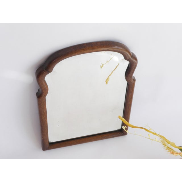 Antique Dutch wooden scalloped mirror with a nice frame and beveled glass. The mirror is from the early 20th century and...