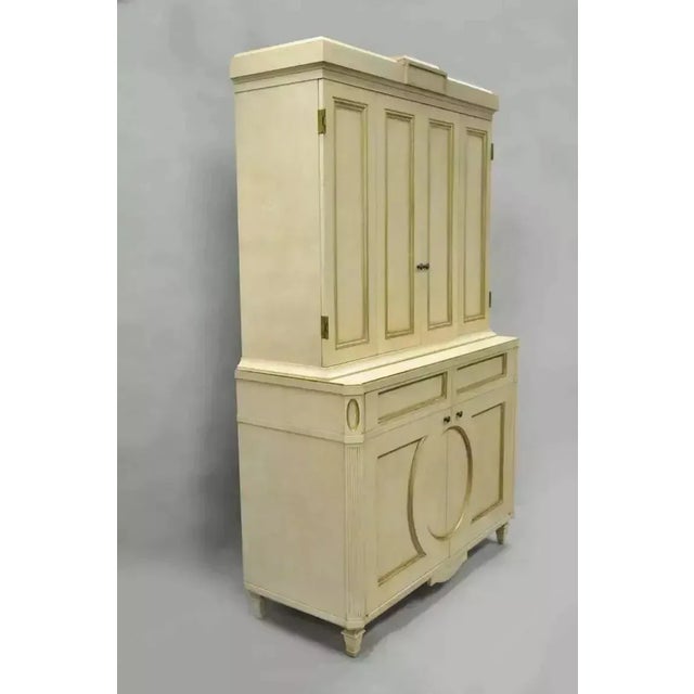 French Neoclassical Louis XVI Style Cream & Gold Painted Bar Cabinet by Decca (B). Item features a heavy two part...