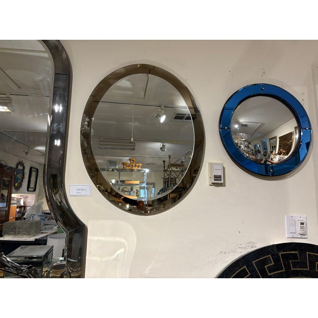 Italian Modern Fontana Arte Inspired Beveled Mirror. This handsome Italian mid-century mirror has a smoked gray perimeter...