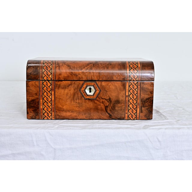 A luxurious English writing box of circa 1879, in the manner of Tunbridge Ware, using burled walnut that has been inlaid...