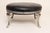 Art Deco cast metal foot stool with cabriole legs and leather upholstery (ca. 1940s, USA). A stylish interpretation of a...