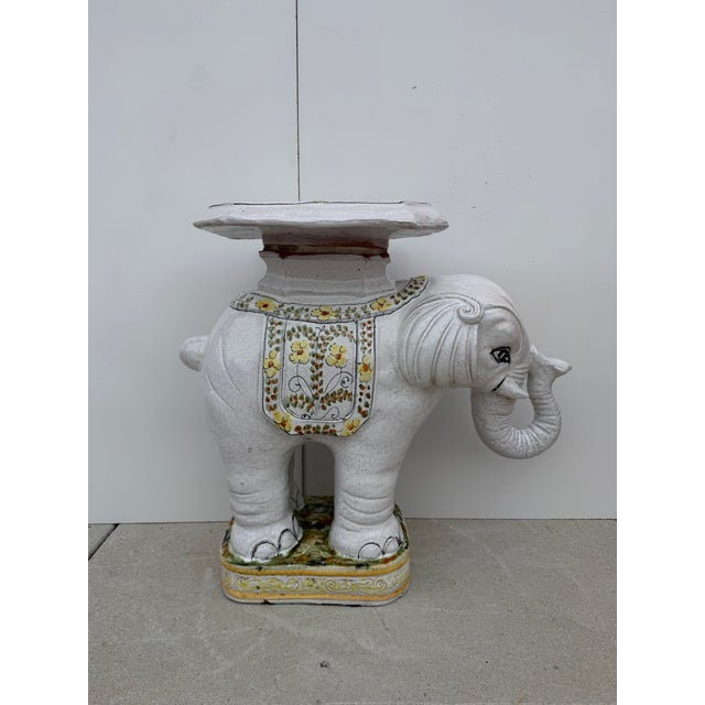 Charming Hollywood Regency–style Italian terracotta elephant garden stool featuring a hand-painted glazed finish with...