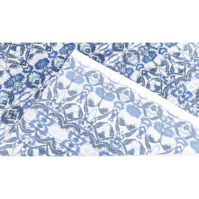 A striking interpretation of traditional textile patterns, this modern hand-knotted silk rug (N12895) blends old-world...