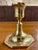 This is a vintage classic brass candlestick holder featuring a traditional Colonial-inspired silhouette with an elegant...