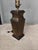 A handsome vintage table lamp by Wildwood featuring a sculptural architectural form and beautifully aged brass finish. The...