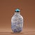This is a finely crafted antique glass snuff bottle, featuring a painted enamel landscape scene on a white ground. The...