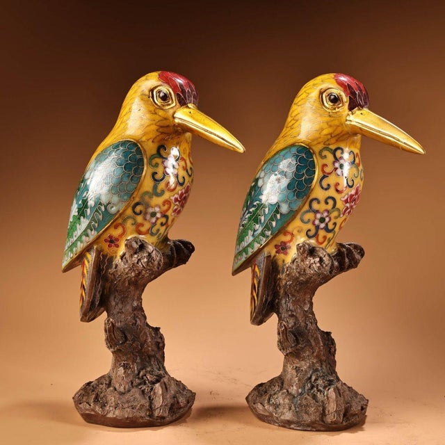 This striking pair of vintage cloisonne enamel figurines features two woodpeckers perched upon sculpted tree trunk bases....