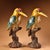 This striking pair of vintage cloisonne enamel figurines features two woodpeckers perched upon sculpted tree trunk bases....