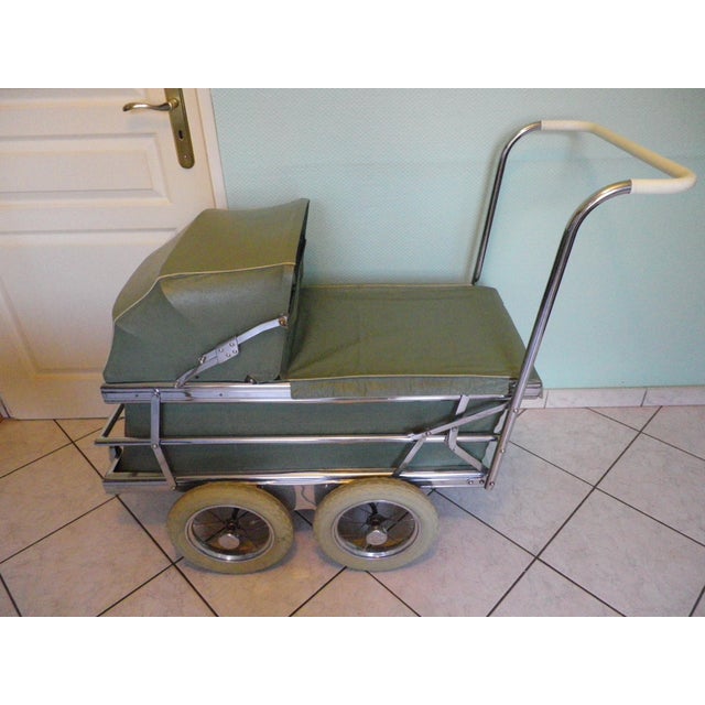 Folding pram by Flandria (Belgium). 1960s. The frame is entirely made of chromed metal. The hood has folding gussets. The...