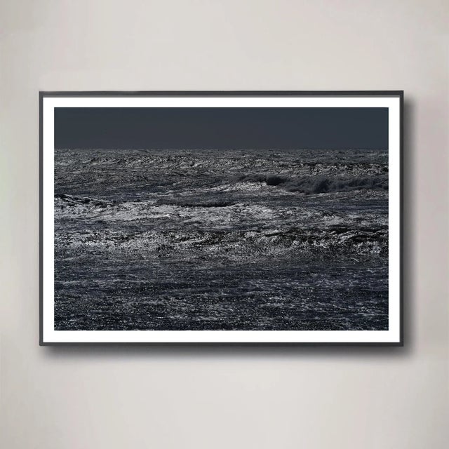 A storm-filled sea of texture in a palette of layered charcoal grays. The Pacific ocean bristles amongst a heavy wind...