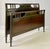 Neoclassical full size bed and rails by Sligh Furniture Co. of Grand Rapids. Likely crafted in the 1920s, this piece...
