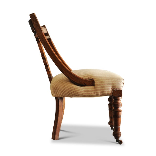 Victorian Striped Upholstery & Oak Open-Frame Library Chair with Carved Motifs & Ceramic Castors For Sale - Image 4 of 5