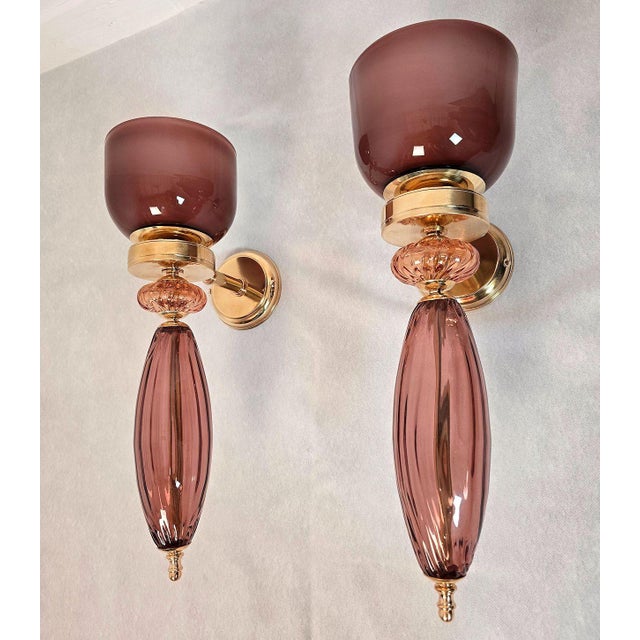 Pair of mid-century modern glass, Murano glass wall sconces, Italy circa 1990s. A neoclassical style Murano glass sconces....