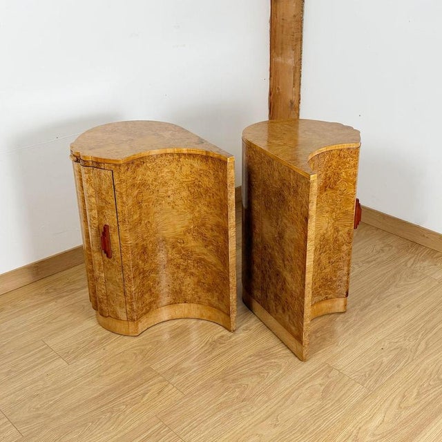 A superb and rare pair of art deco cabinets by harry & lou epstein. Fluted burr walnut veneered curved cabinet door with...