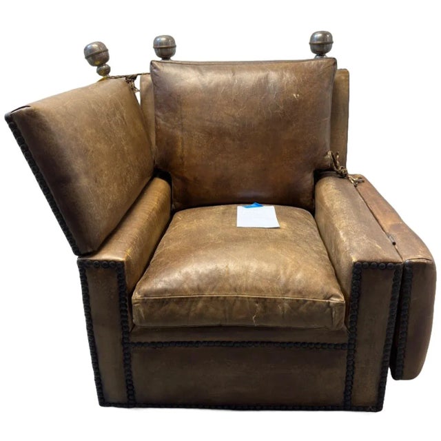 A truly one of a kind late 1800's antique Italian drop arm sofa chair in original leather and brass details. A true...