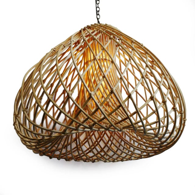 Beautiful thick rattan Java Drop hanging lantern. Attractive swirling design produces a natural glow when illuminated....