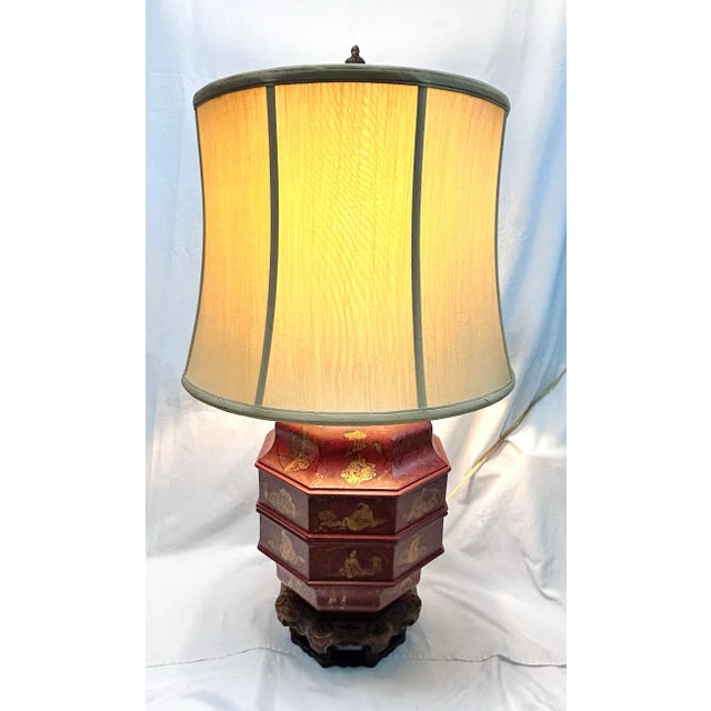 A statement John Richard table lamp inspired by traditional Asian wedding basket forms, rendered in richly lacquered red...