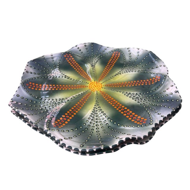 A striking and vibrant pair of vintage mid-century modern ceramic plates, handmade and meticulously hand-painted in South...