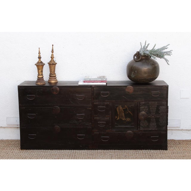 This monumental 69-inch Tansu is a stunning fusion of Japanese Edo-period utility and high-art aesthetic. Originally...